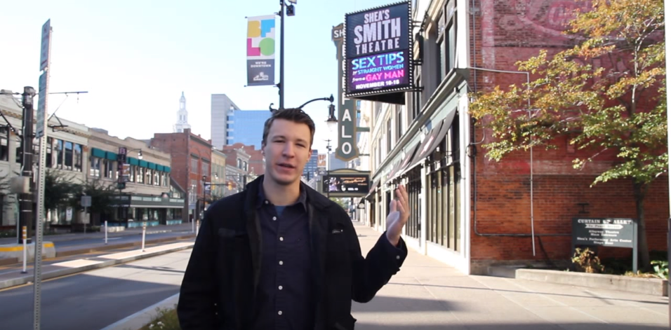 Corey and a sign